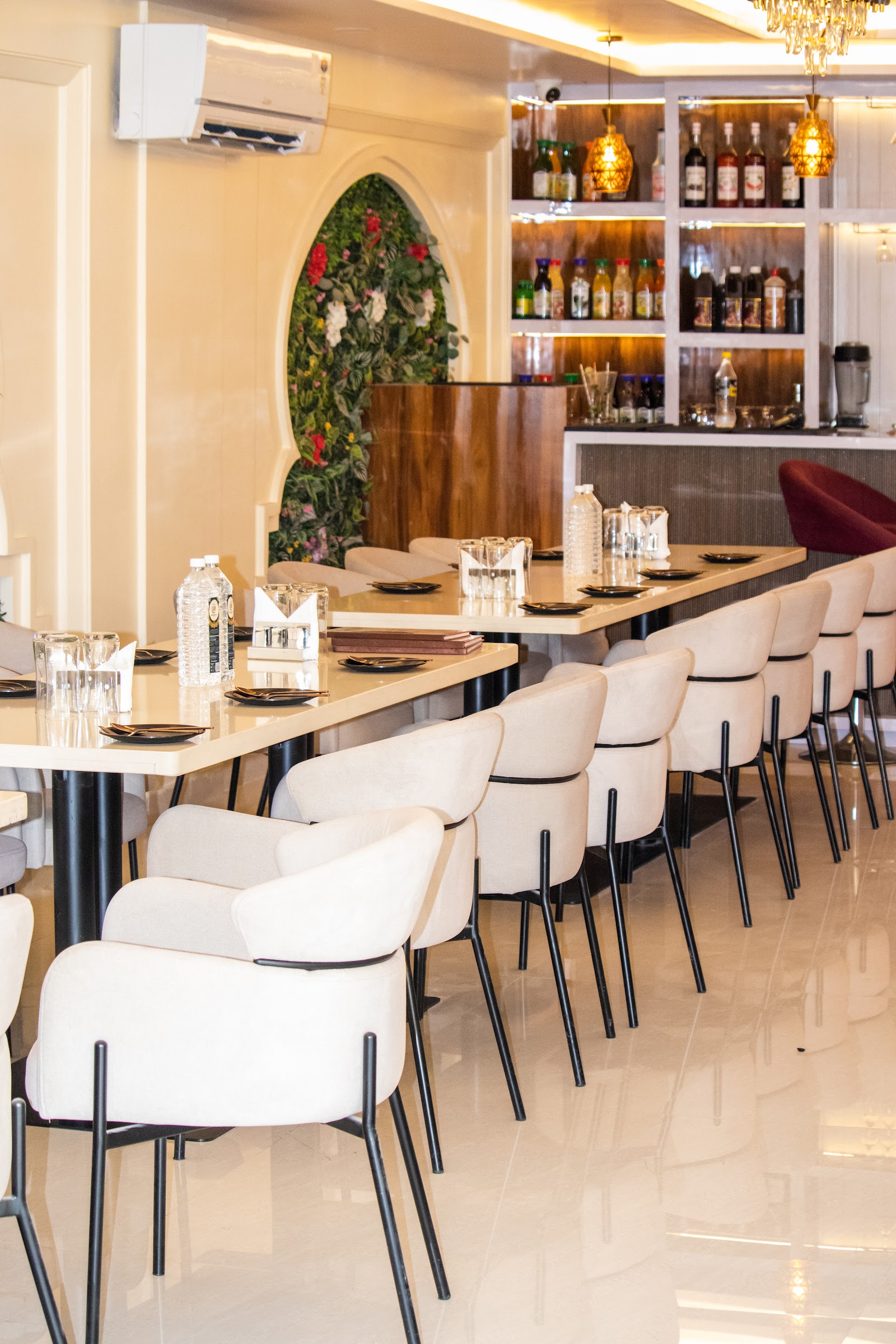 Restaurant seating beside the bar at Mithila Heritage